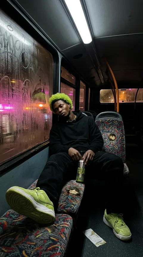 The same man is sitting in the bus advertising the FERAL Bottle.